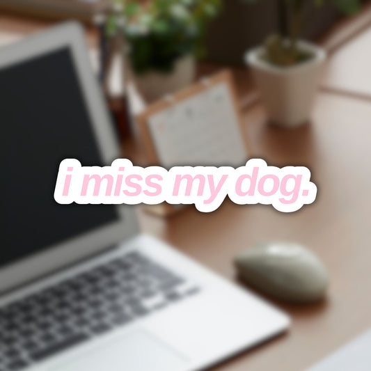 Vinyl sticker with “i miss my dog.” in lowercase sans-serif font, light pink color.