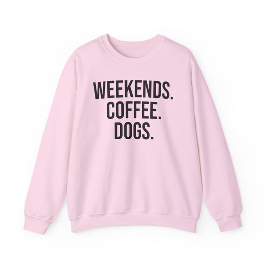 Light pink sweatshirt with 'WEEKENDS. COFFEE. DOGS.' black text on a white background.