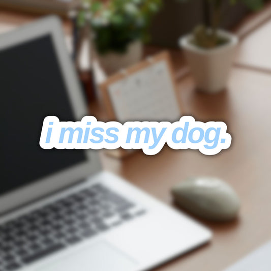 Vinyl sticker with “i miss my dog.” in lowercase sans-serif font, light blue color.