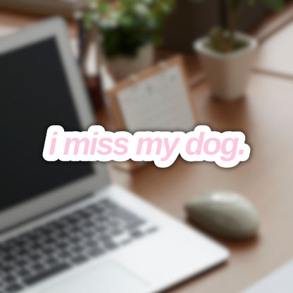 Vinyl sticker with “i miss my dog.” in lowercase sans-serif font, light pink color.