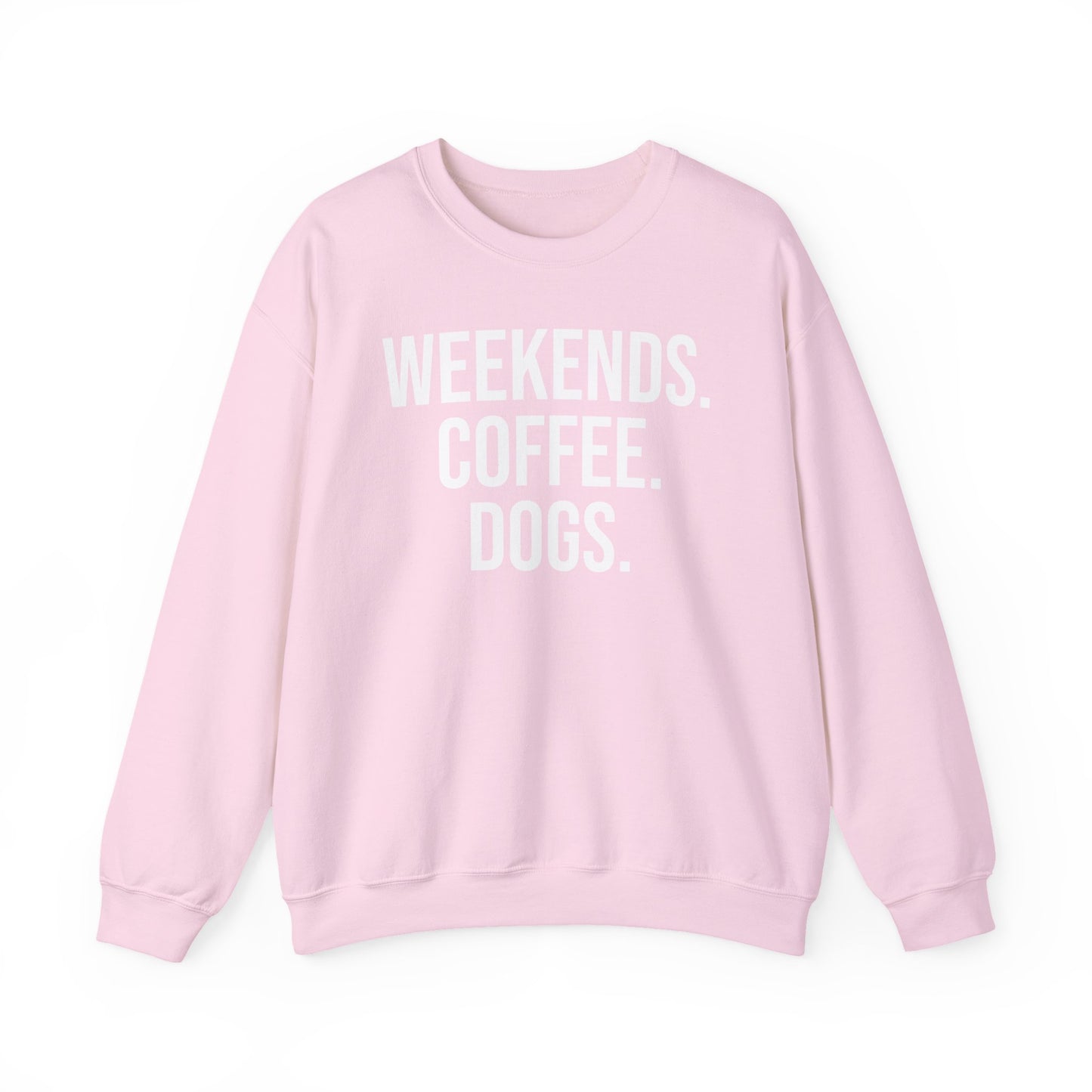 Light pink sweatshirt with 'WEEKENDS. COFFEE. DOGS.' white text on a white background.