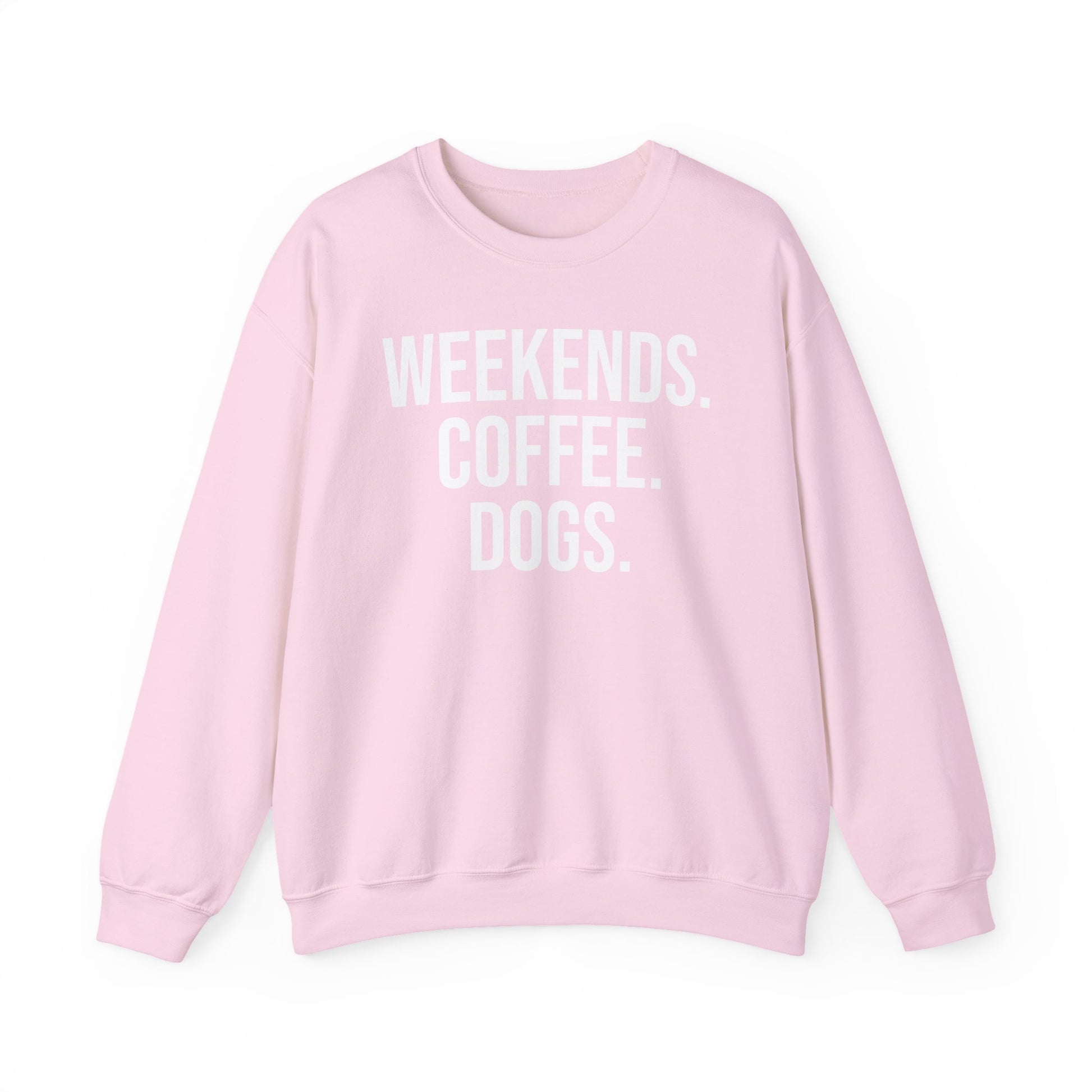 Light pink sweatshirt with 'WEEKENDS. COFFEE. DOGS.' white text on a white background.