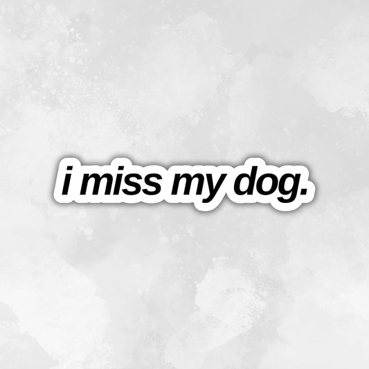 Text 'i miss my dog.' in a black font on a light gray textured background