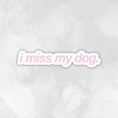 Text 'i miss my dog.' in a light blue font on a light pink textured background