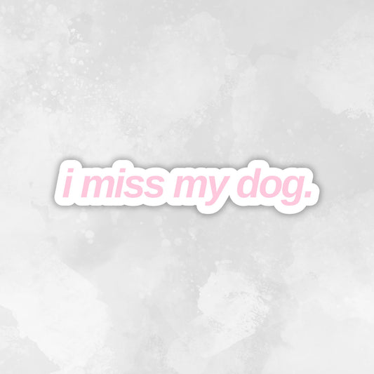 Text 'i miss my dog.' in a light blue font on a light pink textured background