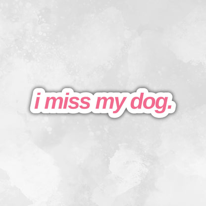 Text 'i miss my dog.' in a pink font on a light gray textured background